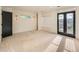 Bright, spacious bedroom featuring large windows and neutral carpet at 22 Rangeview Dr, Wheat Ridge, CO 80215