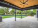 Relax on the covered patio, overlooking the landscaped backyard and lush lawn at 22 Rangeview Dr, Wheat Ridge, CO 80215
