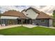 Expansive home featuring a well-manicured lawn, outdoor living space and a large garage at 22 Rangeview Dr, Wheat Ridge, CO 80215