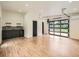 Finished garage space with bar area, sink, and glass garage door at 22 Rangeview Dr, Wheat Ridge, CO 80215