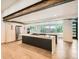 Modern kitchen with stainless steel appliances, sleek cabinetry, and a large island at 22 Rangeview Dr, Wheat Ridge, CO 80215