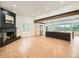 Bright living room with fireplace and an open layout to the kitchen area at 22 Rangeview Dr, Wheat Ridge, CO 80215