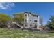 Back of two-story home featuring a staircase, patio area and garden area at 2339 Elkhorn St, Parker, CO 80138