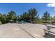 Backyard patio with fire pit, seating, barbecue, and hammock, perfect for entertaining at 2339 Elkhorn St, Parker, CO 80138