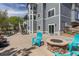 Backyard patio with fire pit, seating, barbecue, and access to house, perfect for outdoor enjoyment at 2339 Elkhorn St, Parker, CO 80138