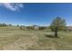Back of two-story home featuring a staircase, patio area and large, grassy lot at 2339 Elkhorn St, Parker, CO 80138