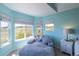Cozy bedroom with ample natural light, a comfortable daybed, and scenic views from the surrounding windows at 2339 Elkhorn St, Parker, CO 80138