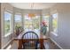 Sunny breakfast nook features a wood table, chairs, and large windows offering panoramic views of the surrounding landscape at 2339 Elkhorn St, Parker, CO 80138