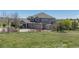 Two-story home featuring stone accents, a covered porch, a spacious three-car garage and storage shed at 2339 Elkhorn St, Parker, CO 80138
