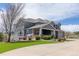 Well-maintained two-story home with manicured lawn and a welcoming covered porch at 2339 Elkhorn St, Parker, CO 80138