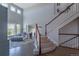 Elegant foyer with hardwood floors, staircase, and an open view to a comfortable living space at 2339 Elkhorn St, Parker, CO 80138
