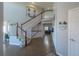 Inviting foyer with hardwood floors, a grand staircase, and stylish decor at 2339 Elkhorn St, Parker, CO 80138