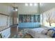 Bright living space with built-in bookshelves, hardwood floors, and comfortable seating at 2339 Elkhorn St, Parker, CO 80138