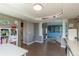 Open-concept living space with hardwood floors, bright light, and a functional work/play area at 2339 Elkhorn St, Parker, CO 80138
