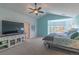 Spacious main bedroom with a ceiling fan, adjacent bay window, and ample natural light at 2339 Elkhorn St, Parker, CO 80138