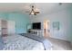 Airy main bedroom with adjacent ensuite and large windows offering ample natural light and space at 2339 Elkhorn St, Parker, CO 80138