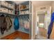 Well organized mud room featuring custom shelving, hooks, and a bench for efficient storage and organization at 2339 Elkhorn St, Parker, CO 80138
