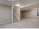 Finished basement features carpet, neutral walls, and a staircase leading to the upper level at 13382 Franklin St, Thornton, CO 80241