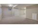 Finished basement with carpet, neutral walls and an access door at 13382 Franklin St, Thornton, CO 80241