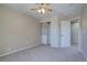 Bedroom featuring neutral walls, carpet, ceiling fan and a built in closet at 13382 Franklin St, Thornton, CO 80241