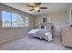 Serene bedroom featuring a comfortable bed, natural light from the window, and neutral décor at 13382 Franklin St, Thornton, CO 80241