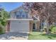 Charming two-story home featuring a brick-accented facade and a well-manicured front yard at 13382 Franklin St, Thornton, CO 80241