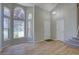 Inviting foyer with abundant natural light, hardwood floors and staircase to the upper level at 13382 Franklin St, Thornton, CO 80241