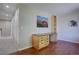 Upstairs office space featuring a built-in desk with storage, hardwood floors, and ample lighting at 13382 Franklin St, Thornton, CO 80241