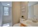 Well-lit powder room featuring modern fixtures, neutral tones, and tile flooring at 13382 Franklin St, Thornton, CO 80241