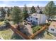 Aerial view of backyard with wooden fence, patio furniture, trampoline, and a gray house at 1024 S Mobile St, Aurora, CO 80017