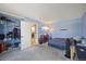 Bedroom with blue walls, closet, dresser with TV, and a black futon at 1024 S Mobile St, Aurora, CO 80017