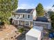 Charming two-story home with solar panels, an attached garage, and well-maintained landscaping at 1024 S Mobile St, Aurora, CO 80017