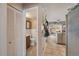 Hallway with closet space leads to a half bathroom, and an open area that leads to the backyard at 1024 S Mobile St, Aurora, CO 80017