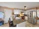 Kitchen with white cabinets, granite countertops, stainless steel appliances and center island with seating at 1024 S Mobile St, Aurora, CO 80017