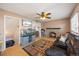 Relaxing living room features a brick fireplace, hardwood floors, and a large aquarium at 1024 S Mobile St, Aurora, CO 80017