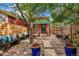 Inviting backyard featuring stone patio, garden with trees, and a seating area at 3321 W 29Th Ave, Denver, CO 80211