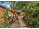 Beautifully landscaped backyard with stone patio, walkway, and cozy seating at 3321 W 29Th Ave, Denver, CO 80211