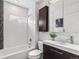 Modern bathroom design with white subway tile, sleek vanity, and decorative black and white accent tiles at 3321 W 29Th Ave, Denver, CO 80211