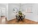 Bright dining area with a stylish light fixture, glass table and chairs, creating an inviting atmosphere at 3321 W 29Th Ave, Denver, CO 80211
