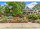 Landscaped front yard with a terraced garden and charming home exterior at 3321 W 29Th Ave, Denver, CO 80211