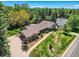 Aerial view of home showing the landscaping, driveway, and surrounding greenery at 4000 S Dahlia St, Cherry Hills Village, CO 80113
