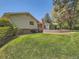 Expansive backyard with lush lawn and tiered landscaping, ideal for outdoor activities at 4000 S Dahlia St, Cherry Hills Village, CO 80113