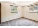 Bedroom features neutral walls, carpeting, and window with decorative bars at 4000 S Dahlia St, Cherry Hills Village, CO 80113