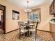 Cozy breakfast nook with a round table, comfortable seating, and a view of the outdoors at 4000 S Dahlia St, Cherry Hills Village, CO 80113