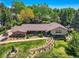 Stunning home with lush landscaping, mature trees, and a well-maintained lawn at 4000 S Dahlia St, Cherry Hills Village, CO 80113