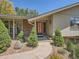 Inviting front entrance with a walkway, attractive landscaping, and a decorative front door at 4000 S Dahlia St, Cherry Hills Village, CO 80113