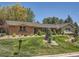 Charming home featuring a brick facade, manicured lawn, and inviting curb appeal at 4000 S Dahlia St, Cherry Hills Village, CO 80113