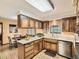 Well-equipped kitchen with custom cabinets, bright countertops, and an adjacent dining area at 4000 S Dahlia St, Cherry Hills Village, CO 80113