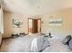 Bright main bedroom with carpet, neutral decor, and ensuite bathroom access at 4000 S Dahlia St, Cherry Hills Village, CO 80113