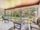 Bright sunroom featuring large windows and tile flooring, perfect for relaxation at 4000 S Dahlia St, Cherry Hills Village, CO 80113